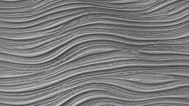 Abstract grey surface featuring elegant flowing wave patterns in textured relief