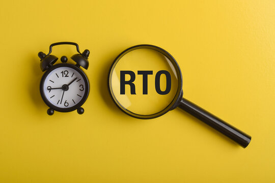 Alarm clock and magnifying glass highlighting RTO text on yellow background, representing return to origin shipments, delivery issues, logistics management, and shipping deadlines.