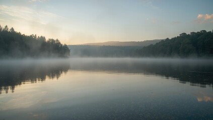Fototapeta premium Soft morning glow illuminating a peaceful lake with still water and quiet surroundings