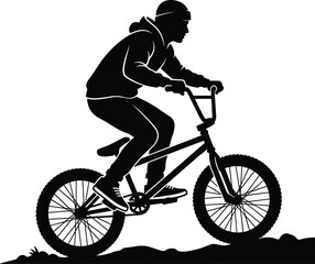 Obraz premium Silhouette of a person riding a bmx bike on a hill, wearing a hoodie and sneakers cyclist