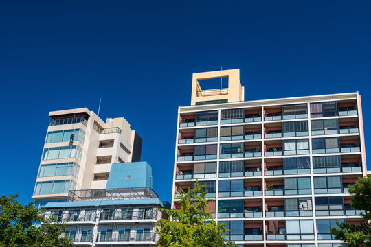 Window cleaner man cleansing on aparment building, Fukuoka