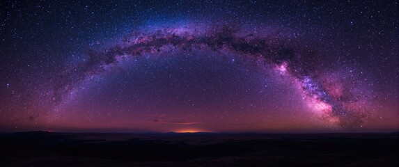 Fototapeta premium Landscape under a brilliant Milky Way galaxy featuring rich purple and blue hues