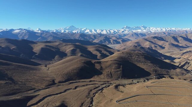 Drone reveal of Mount Everest from the famous 108 switchbacks at Gawula Pass, Tibet, China