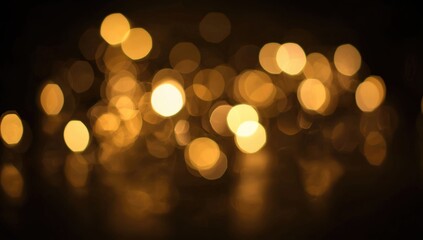 Fototapeta premium Golden bokeh lights against a dark background