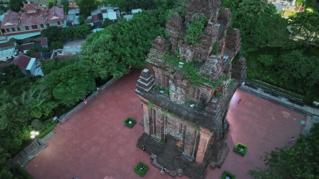 Top down drone view of Nhan Tower courtyard and Cham architecture surrounded by trees in Tuy Hoa city.