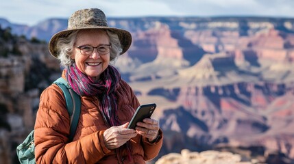 Fototapeta premium Senior woman with phone outdoors