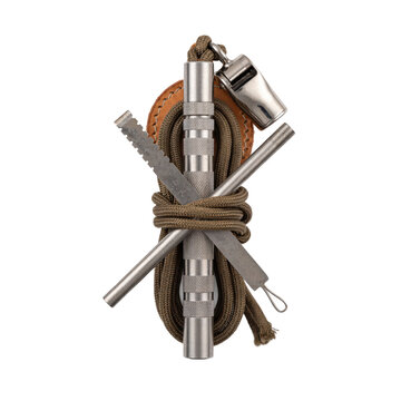 Survival kit components including a metal whistle, fire starter rod, and paracord rope for outdoor camping gear isolated on a white background isolated on a transparent background