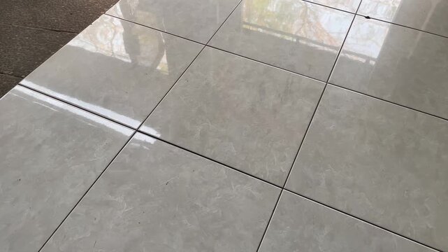 Glossy ceramic floor tiles texture with shadow reflection