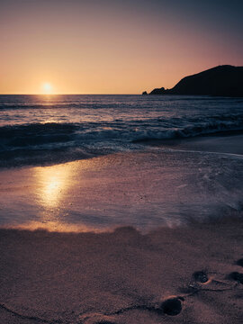 Finisterre Sunset in Galicia, Spain. Mar de Fora beach and Nave cape in Costa da Morte. This is the final step in the Camino de Santiago.
