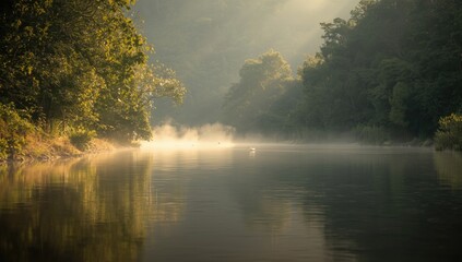 Fototapeta premium Still river bordered by thriving greenery illuminated by misty dawn rays