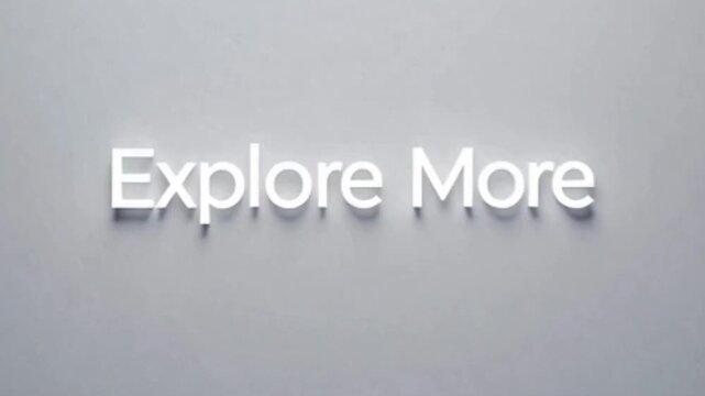White 'Explore More' text with a subtle shadow effect on a light grey background, suggesting discovery and further engagement.