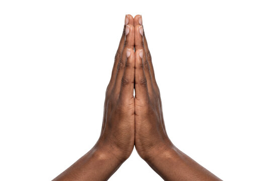 Dark skinned hands pressed together in prayer and greeting