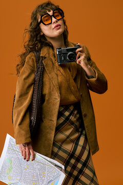Young woman in stylish summer attire explores new places for her travel adventure