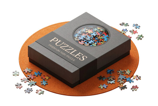 Premium jigsaw puzzle box with scattered pieces on mat