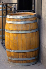 Fototapeta premium Retro closed wooden barrel outside on urban city street