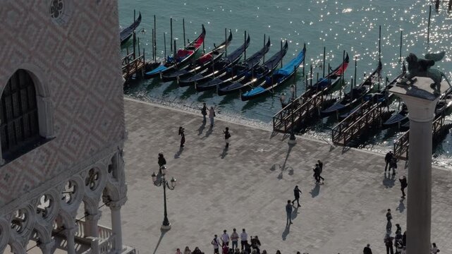 Slow Motion Gondolas and Sunlit Reflections in Venice Square