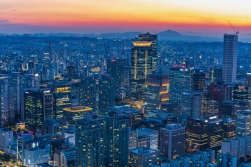 Fototapeta premium High-angle panoramic view of Yeouido financial district skyscrapers at sunset in Seoul, South Korea