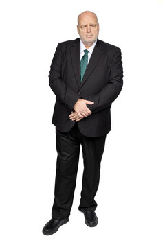 Full length businessman portrait in suit standing on white background looking directly at camera
