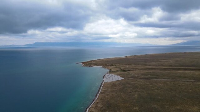 Aerial View of Sayram Lake with Waves Crashing on Rocky Shore, Xinjiang, China