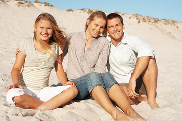 Fototapeta premium Portrait, travel and parents with child at beach for love, adventure and bonding on holiday. Smile, people and comfortable at seaside with daughter, connection and weekend break for tropical vacation