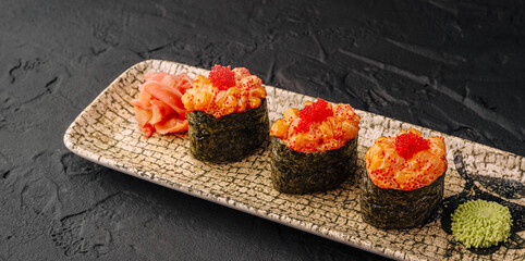 Spicy salmon gunkan maki with caviar and ginger © AntAlexStudio