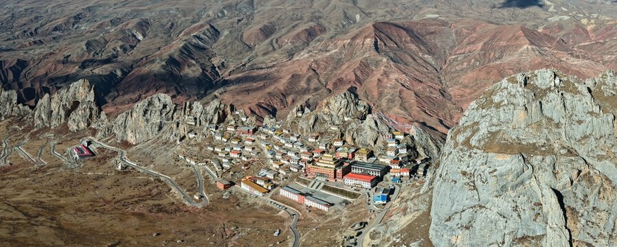 Aerial panorama of Zizhu Monastery perched on a sacred rocky peak, Tibet, China