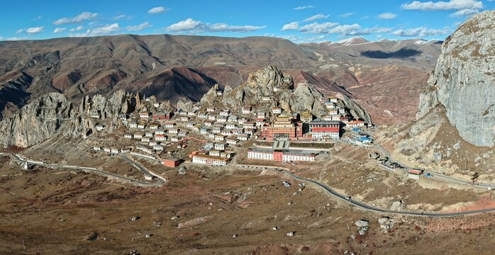 Aerial panorama of Zizhu Monastery perched on a sacred rocky peak, Tibet, China