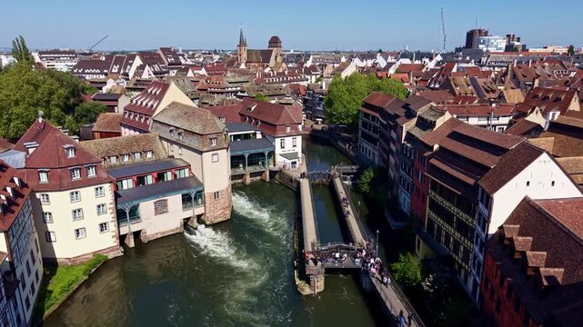 Passerelle des Anciennes-Glaci&egrave;res and Place Benjamin Zix in historic Petite France district in Strasbourg, France. Aerial forward