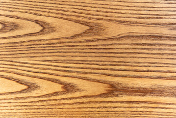 Obraz premium Natural ash wood texture background with beautiful wavy grain pattern.