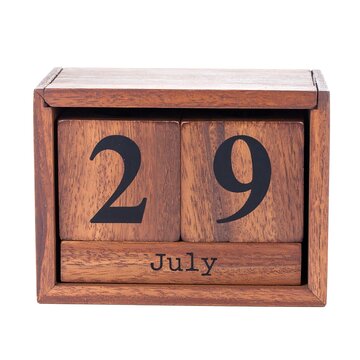A wooden perpetual calendar displaying the date 29 July