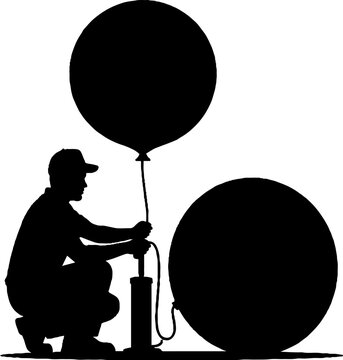 Silhouette of person inflating large balloon outdoors.