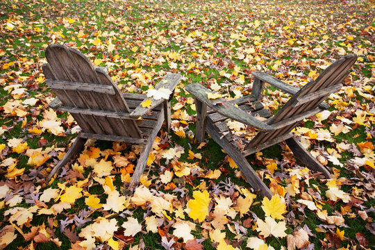 Two old Adirondack Chairs in Autumn