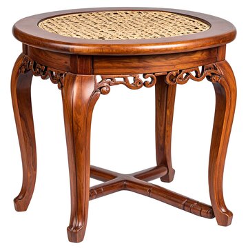 A wooden side table with a round woven rattan top and ornate curved legs