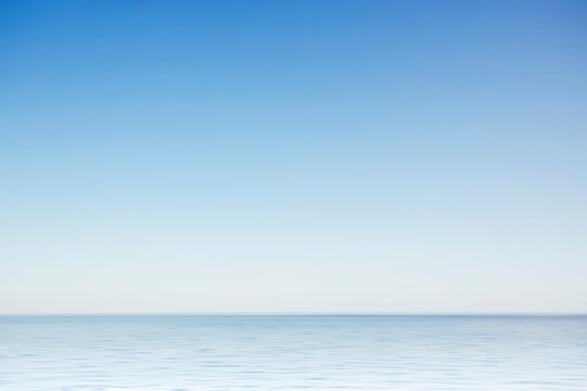 Clear morning sky above calm surface of North Atlantic