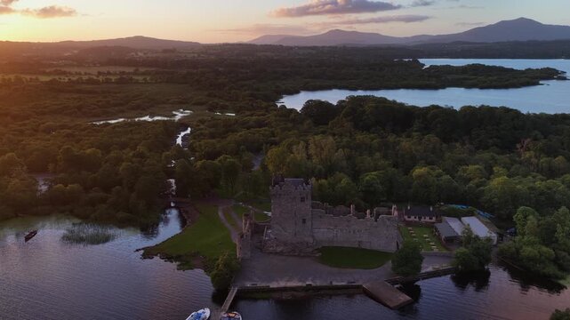 drone view of Killarney national park in Ireland, scenic Irish lake in the morning at sunrise, medieval Ross castle ruins on the lake, Irish landscape