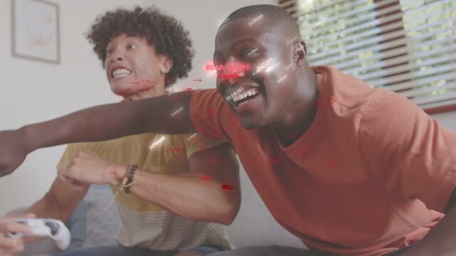 Two male players reacting to gaming sell alert HUD, leaning forward holding white controllers