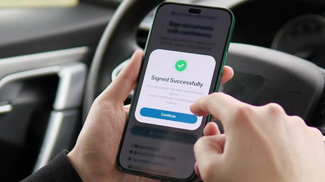 a phone showing a signed document confirmation inside a car. The popup confirms electronic signing with a clear Continue button. Great for showcasing mobile productivity, trust, and digital business
