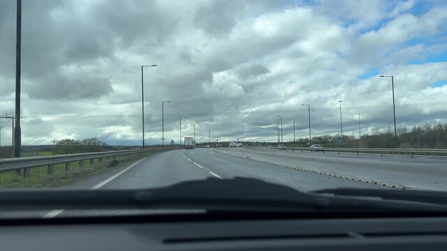 Car dashboard view driving Great Yorkshire Way in Doncaster area, England.
