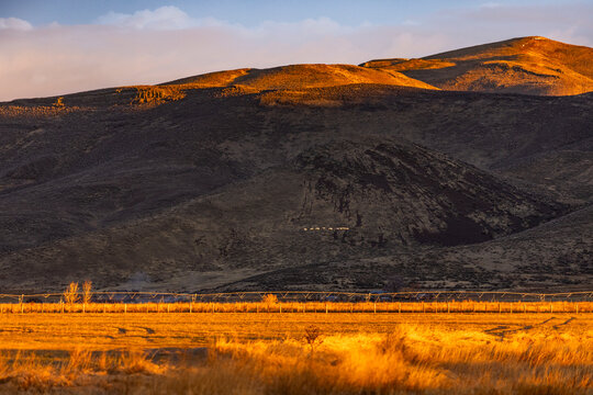 Fields and hills at sunset