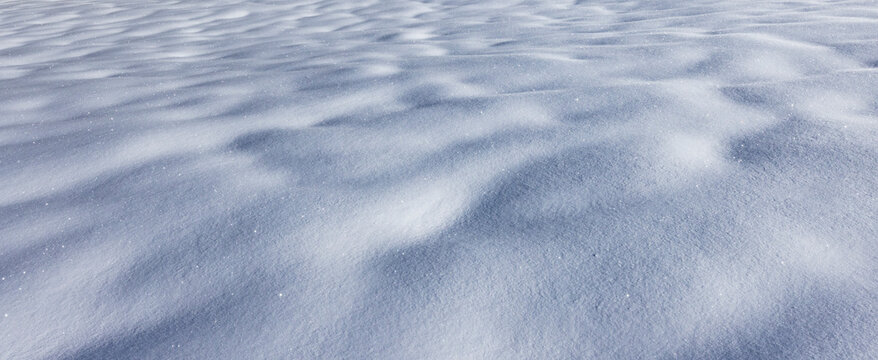 Close-up of snow surface on sunny day