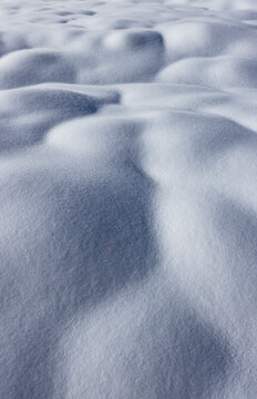 Close-up of snow surface on sunny day