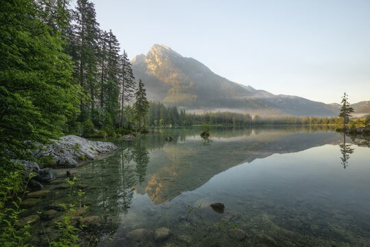 Magical sunrise with fog at Hintersee near Ramsau in Berchtesgadener Land