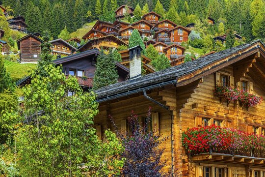 Wooden chalet decorated with flowers, Grimentz, Val d'Anniviers, Valais Alps, Canton Valais, Switzerland