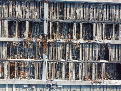 Aerial view of the collapsed roof and structural damage of an industrial building in Scarmagno, Piedmont, Italy.