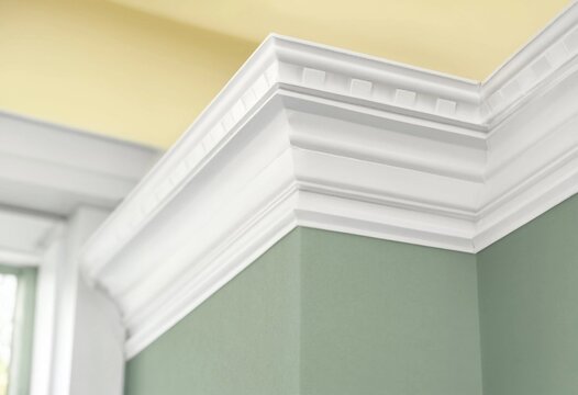 Overhead interior view of Georgian crown molding featuring detailed dentil texture, showcasing historic architectural design, elegant craftsmanship, and classic ornate ceiling interior detail.