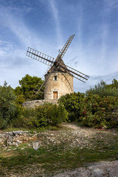 Antique windmill in rural landscape