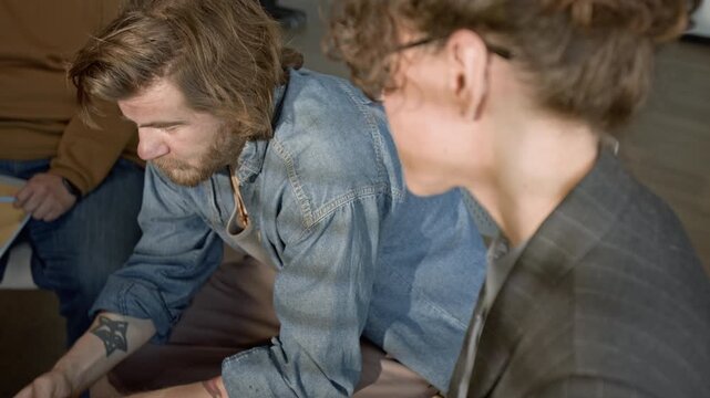 Caucasian female psychotherapist comforting distressed Caucasian young man by putting hand on shoulder. Clip for promoting mental health counseling services