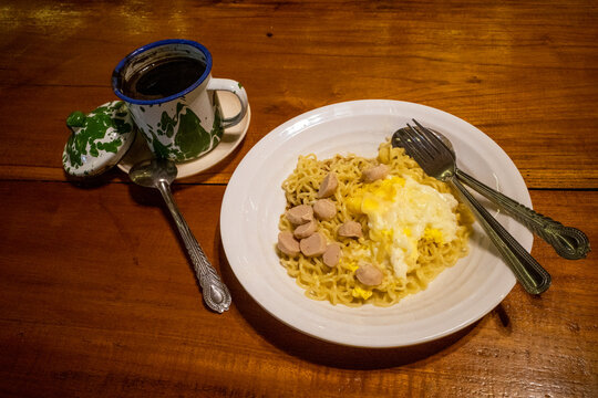 Mie Goreng Telor, Indonesian traditional street food, fried noodles with egg cooked with spices typical of Javanese cuisine
