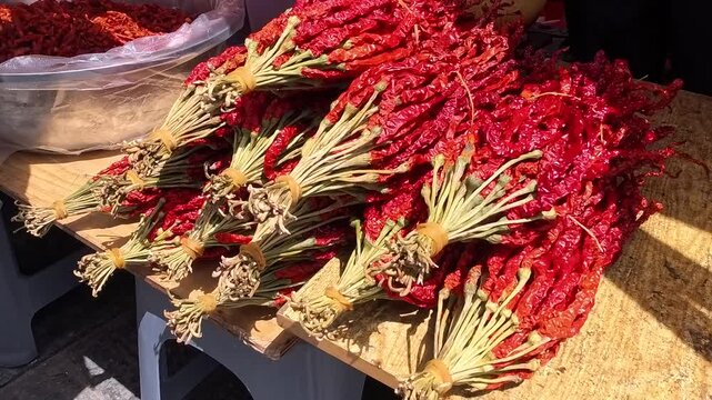 dried hot chilli pepper selling in stall,  market, bazaar, 4k closed up footage
