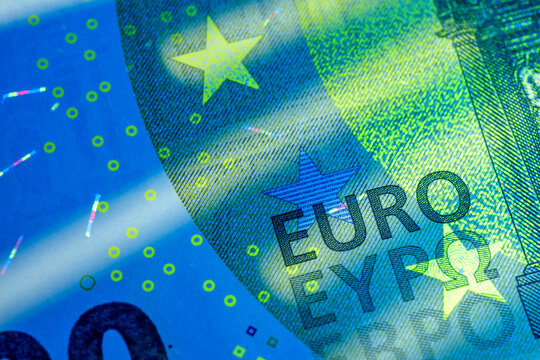 Euro banknote showing security features under ultraviolet light